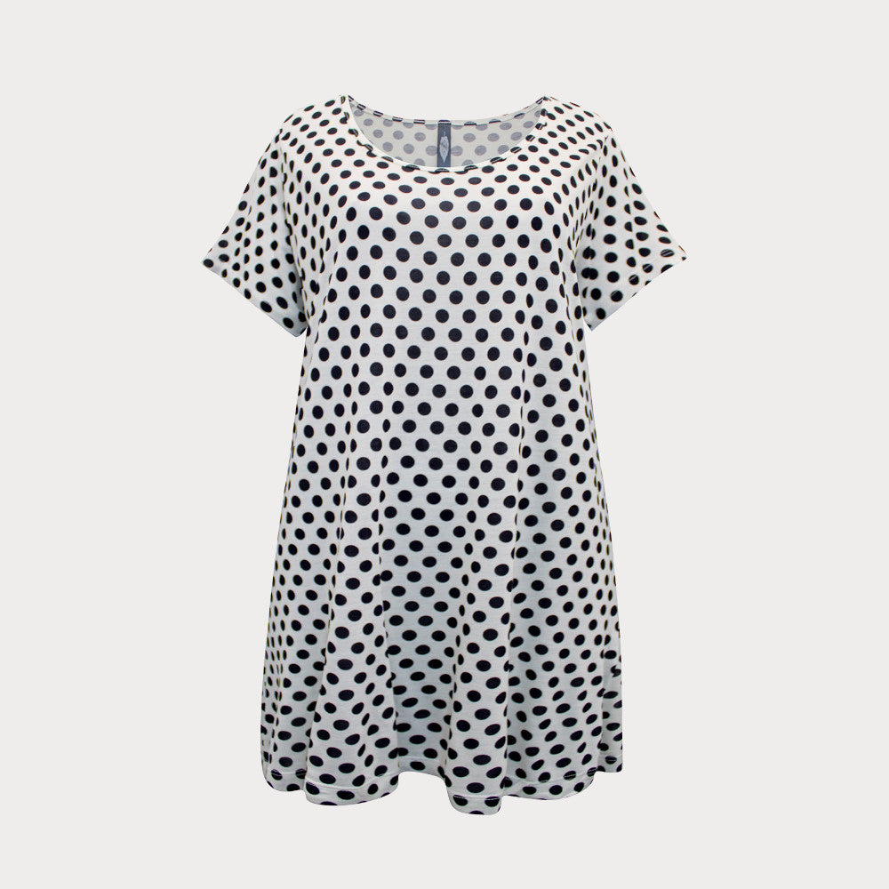 Black and white short sleeved spotty top with round neckline, cut to a longer length. 