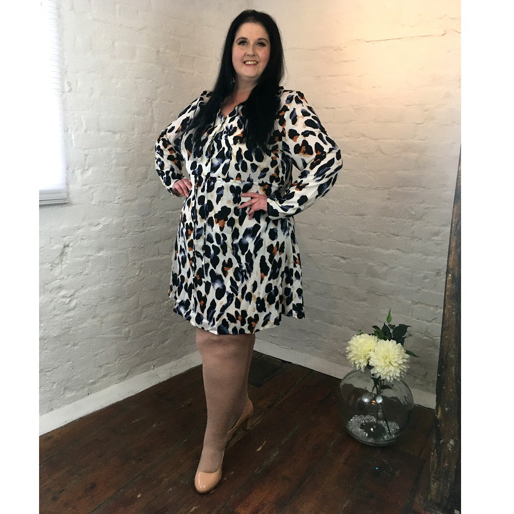 Plus size leopard print shirt dress with drawstring waist, photographed against a white background. 