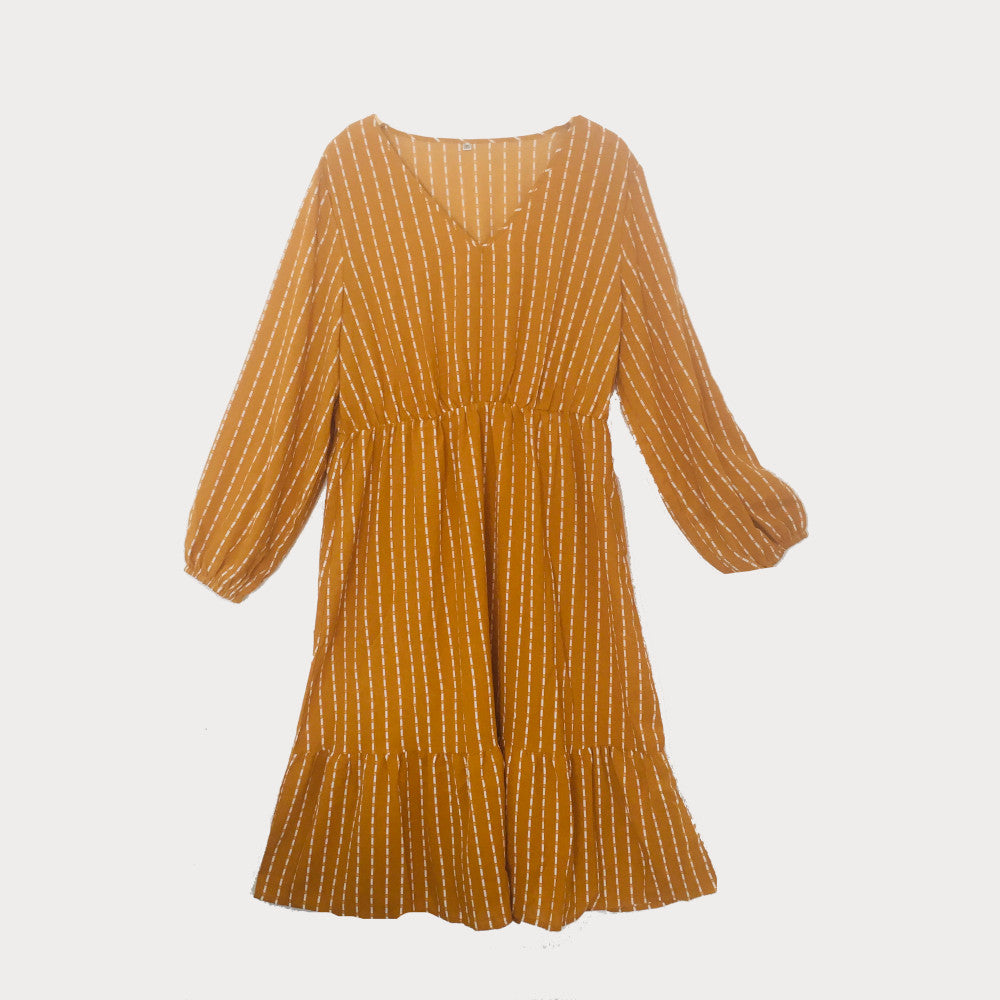 Ochre plus size midi dress with white stripe to the fabric and a cinched waist. 