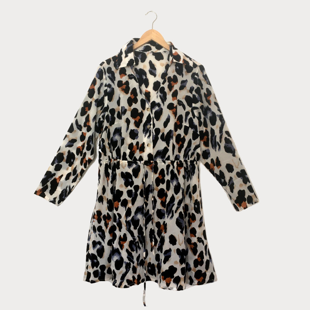 Plus size leopard print shirt dress with drawstring waist, photographed against a white background. 