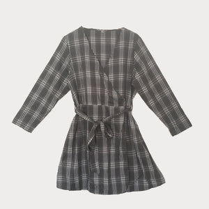 Plus size grey and white v-neck check dress with a tie waist and long sleeves. 