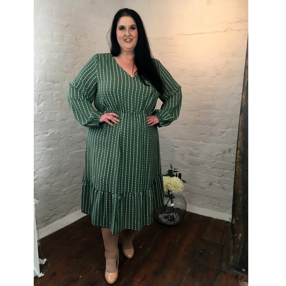 Sage green plus size midi dress with white stripe to the fabric and a cinched waist. 